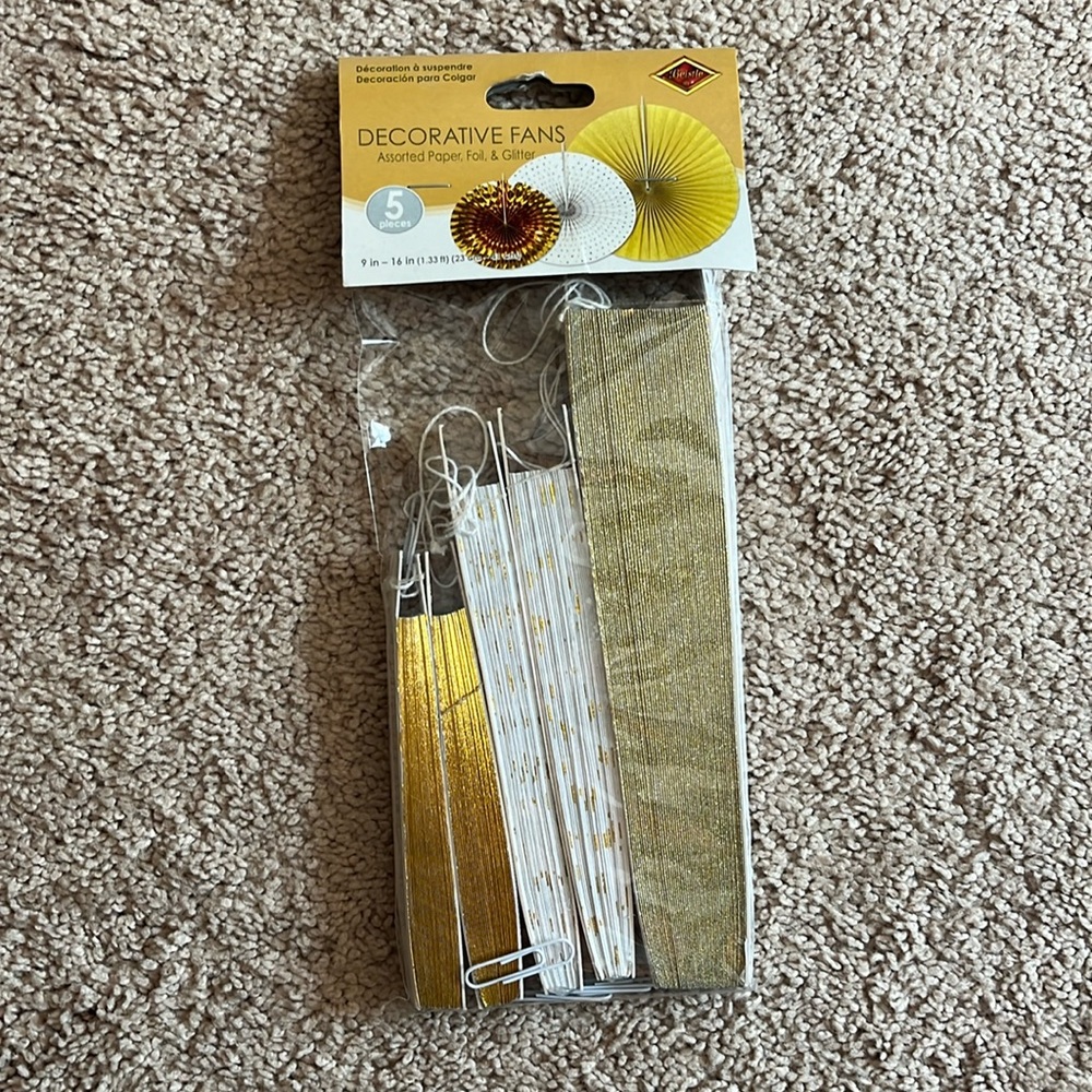 Decorative fans, paper foil, and glitter
